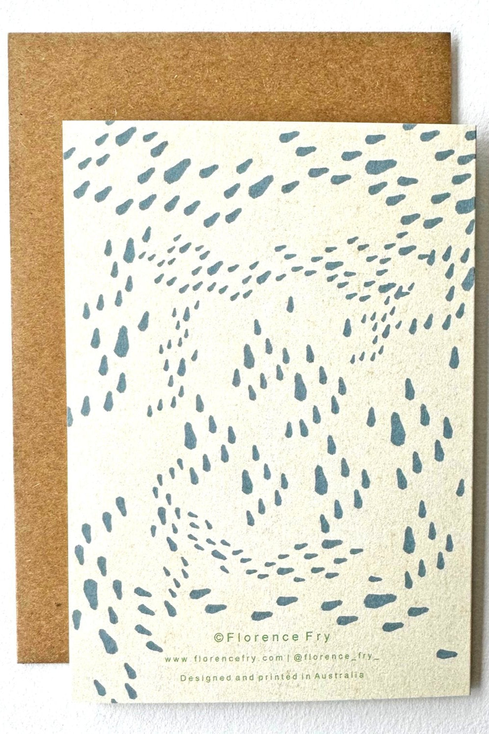The FLORENCE FRY "Snappy Birthday" card features scattered blue-grey raindrops on cream and comes with a recycled Kraft envelope. Artist’s name and website appear in small text at the bottom.