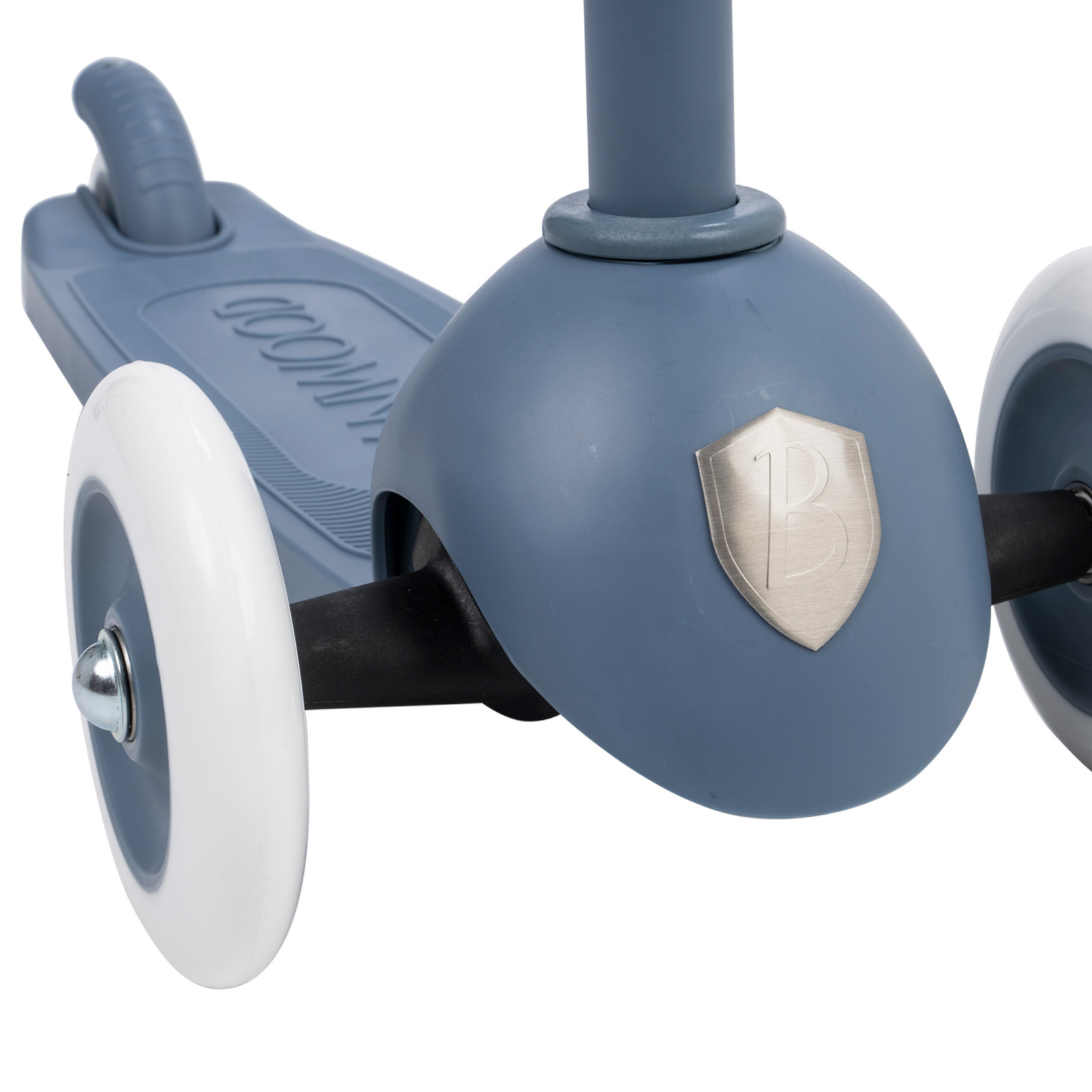 Close-up of the Banwood - Eco Scooter Deep Sea displaying the front wheel and deck. It features a metallic "B" emblem on the front, white wheels, and embodies sustainable design using recycled plastic.
