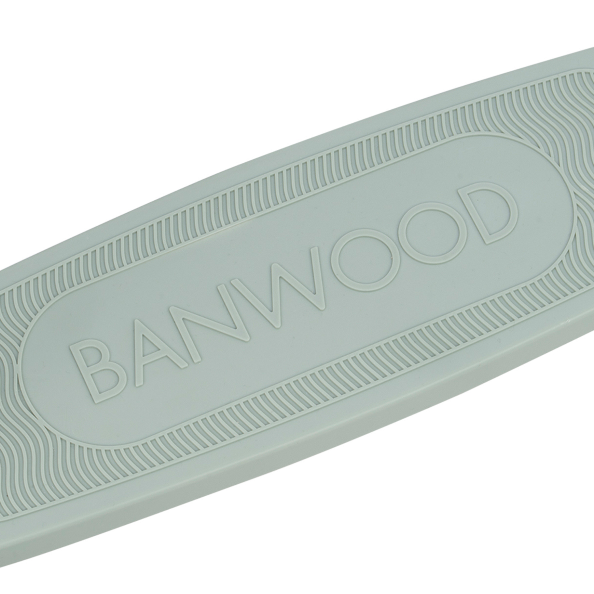 Close-up of a light-colored, oval, textured surface from recycled plastic with "BANWOOD" embossed centrally. The grooved border reflects the sustainable design of the Banwood Eco Scooter Clay.