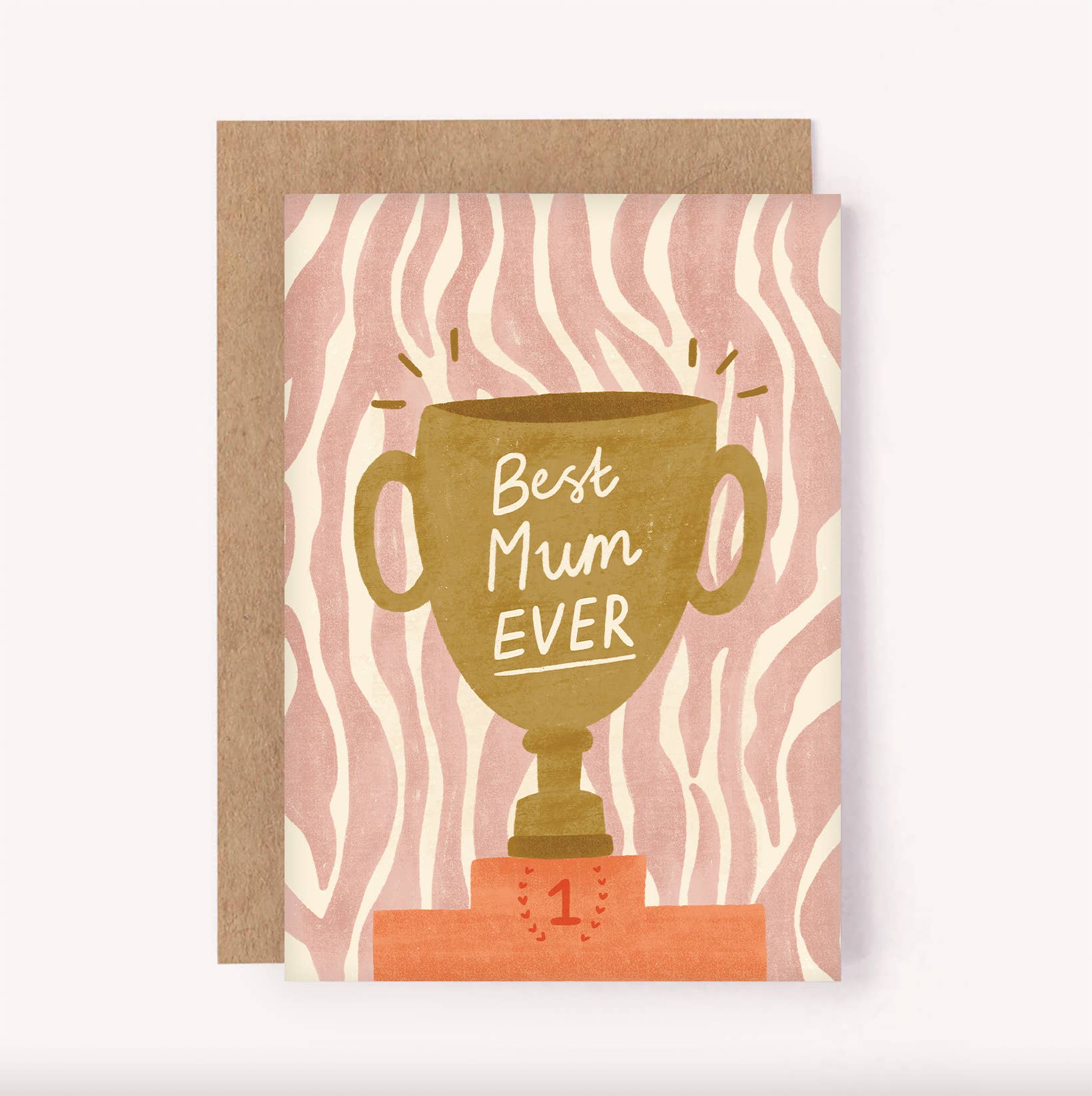 The "Best Mum Ever Trophy Greeting Card" by Lauren Sissons Studio features a gold trophy on a red “1” podium, with "Best Mum Ever" text and a pink and cream wavy striped background. Printed on recycled card stock.