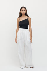 Full length view of woman wearing Sete Linen Elastic Waist Pant in white.
