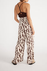 Rear view of woman wearing Muse Wide Leg Pant with brown cami.