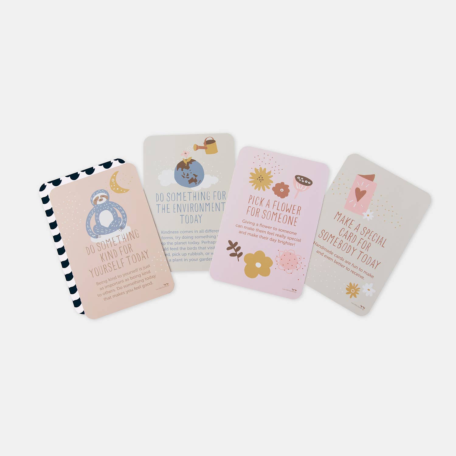 The "Kindness Matters" set by TWO LITTLE DUCKLINGS includes four pastel-colored, eco-friendly cards featuring joyful illustrations and positive messages for kids. The uplifting messages are: “Do something kind for yourself today,” “Do something for the environment today,” “Pick a flower for someone,” and “Make a special card for somebody today.”