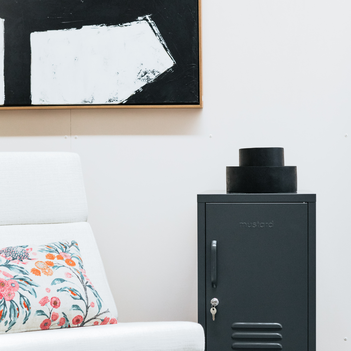 The shorty (to the right) locker in slate next to chair.