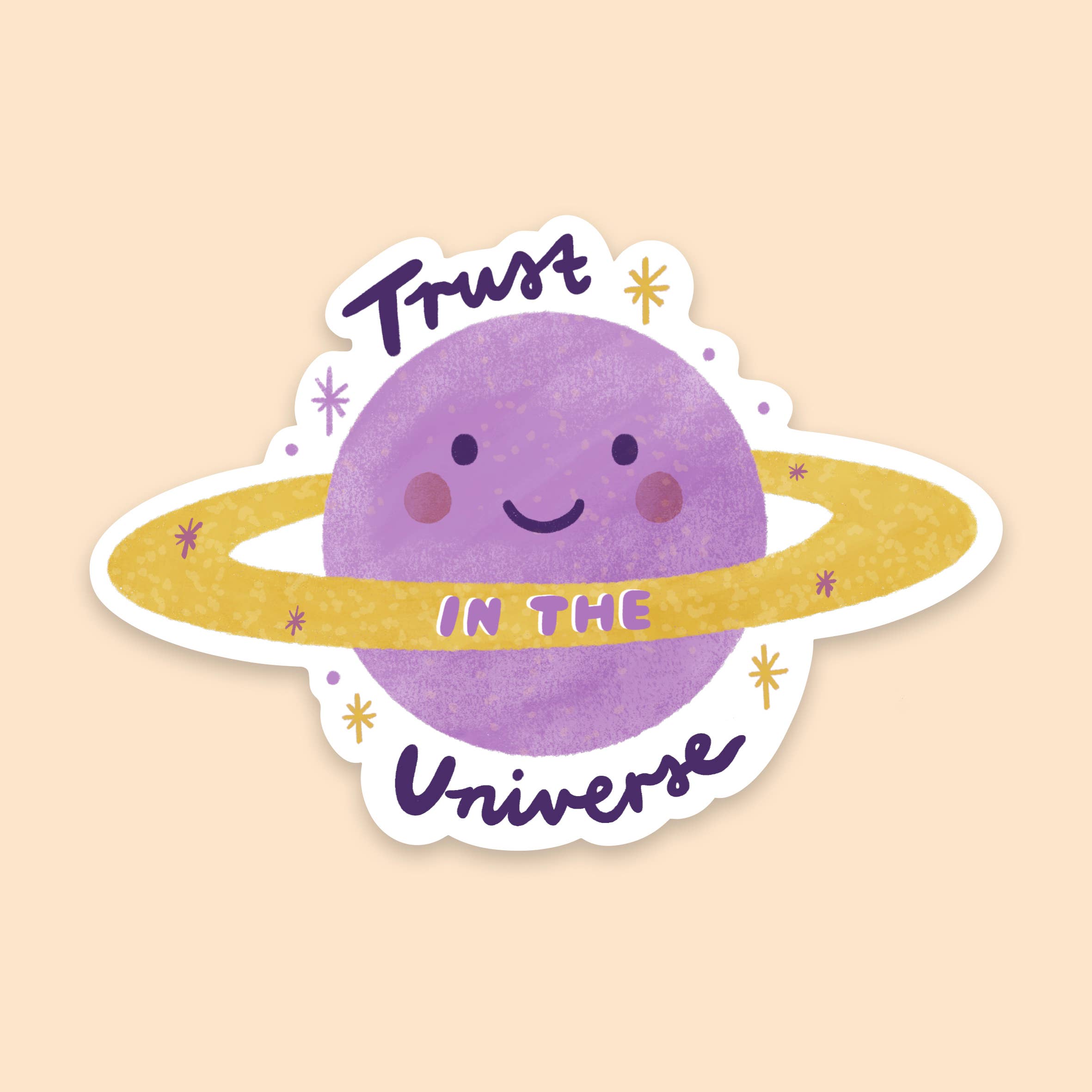 The "Trust in the Universe Sticker" by LAUREN SISSONS STUDIO features a whimsical illustration of a purple planet adorned with a golden ring, all set against a light beige backdrop. The phrase "Trust in the Universe" is crafted in a playful font, where "Trust" and "Universe" are in black and "in the" is integrated within the planet's gold ring. This cosmic vinyl sticker makes for an ideal decorative piece for laptops or any surface, perfect for those who believe in the power of the universe.