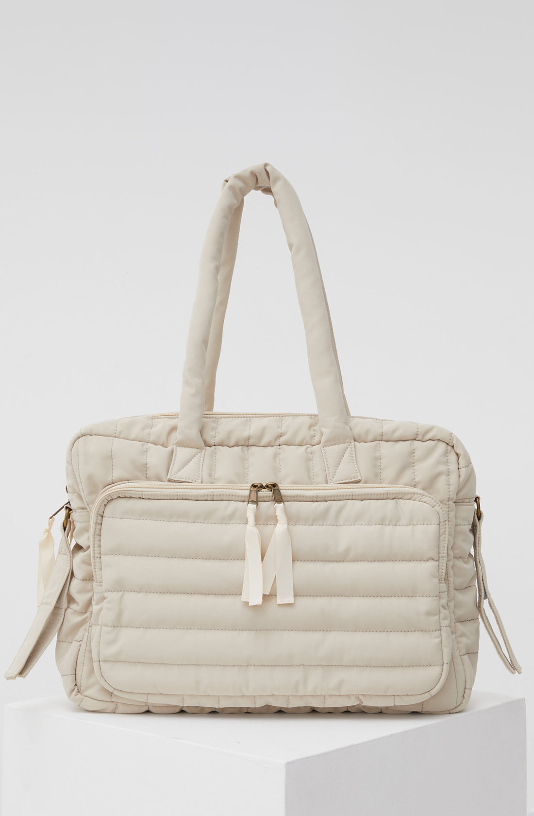 PHILÉ baby bag in cream.