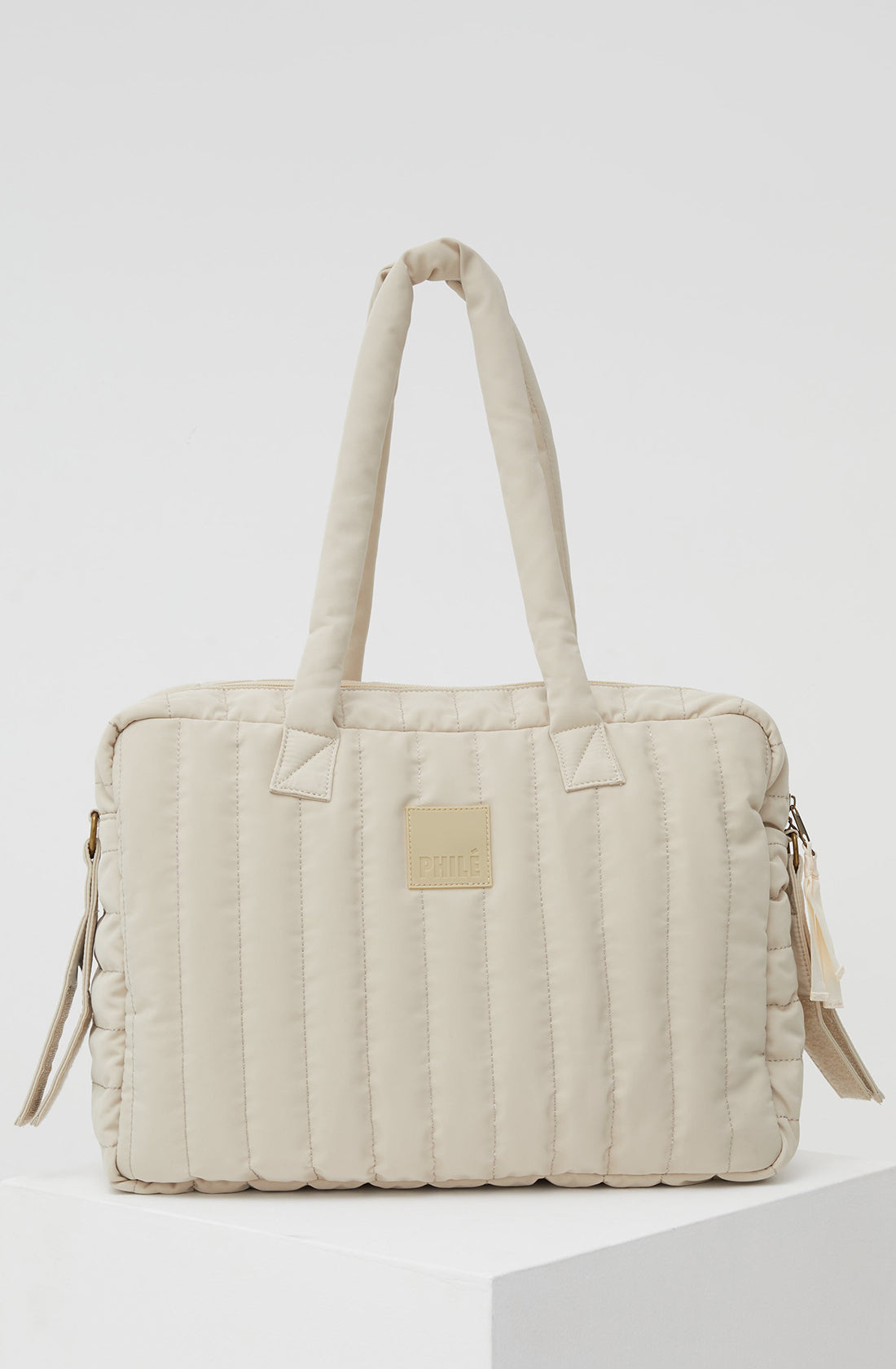 PHILÉ baby bag in cream from the back.