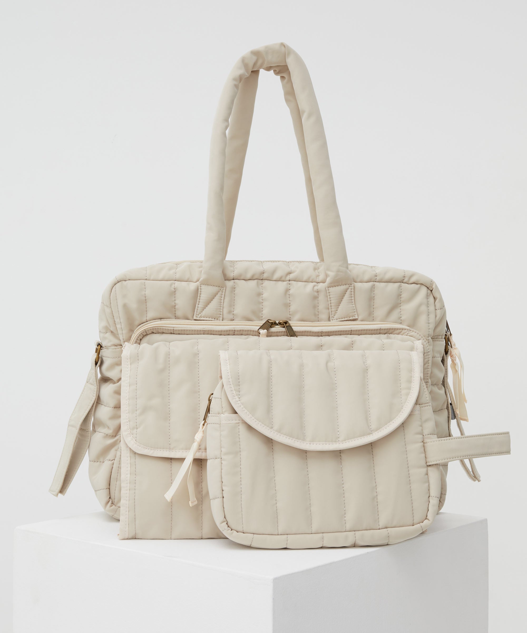 PHILÉ baby bag in cream in large, medium and small.