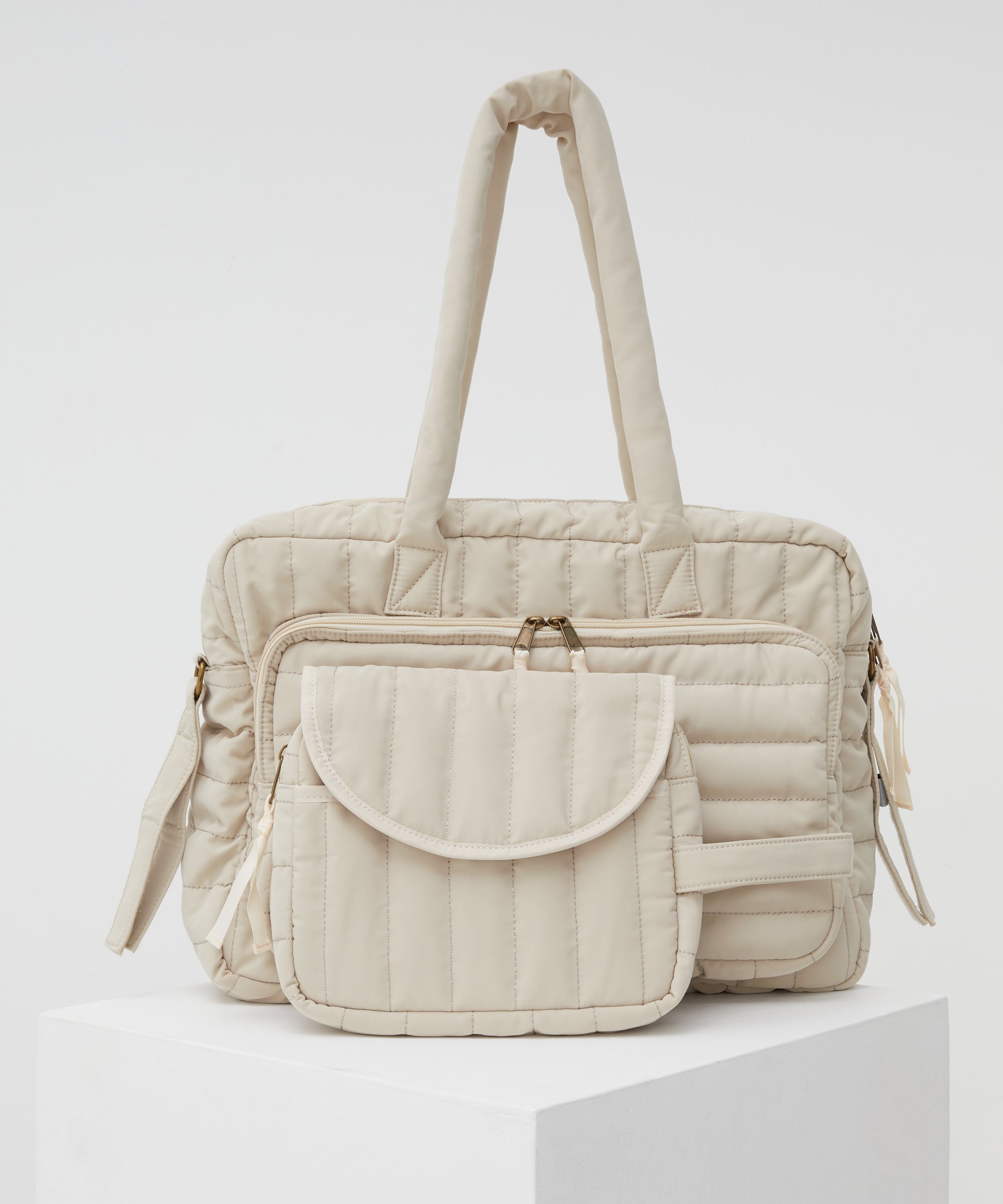 PHILÉ baby bag in cream in large and small.