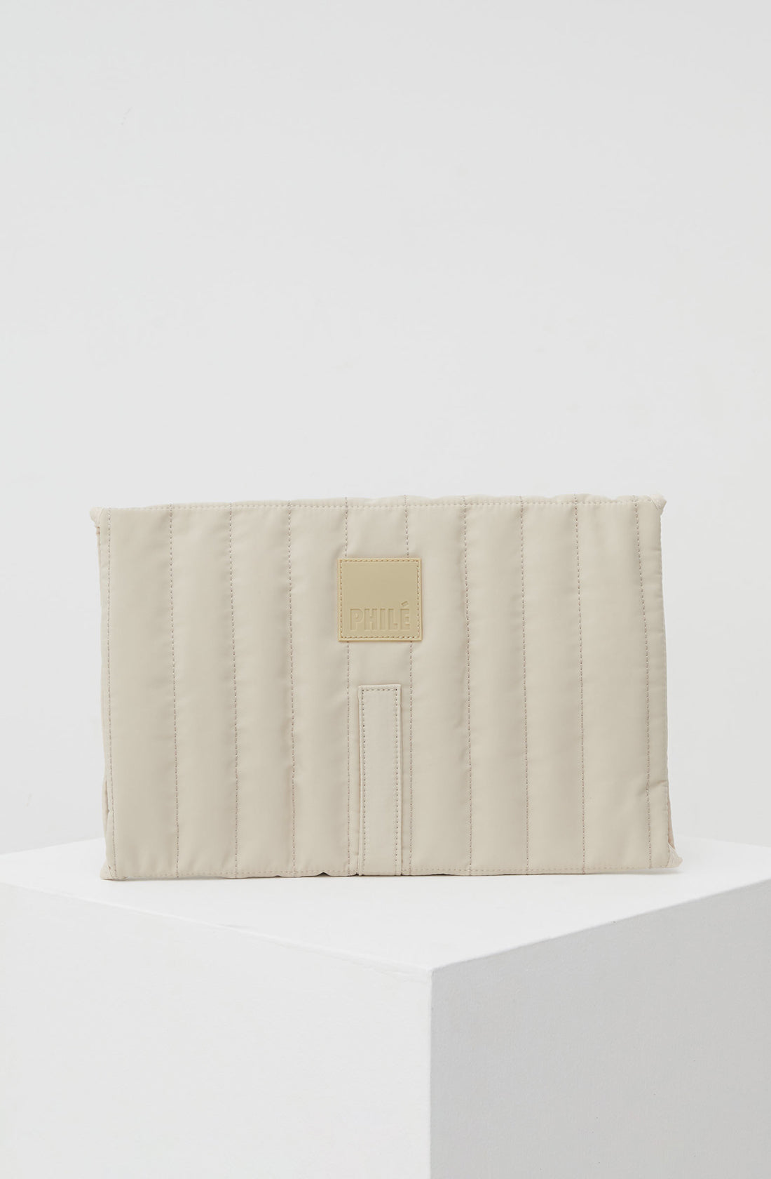 PHILÉ travel changing mat in cream from the back.