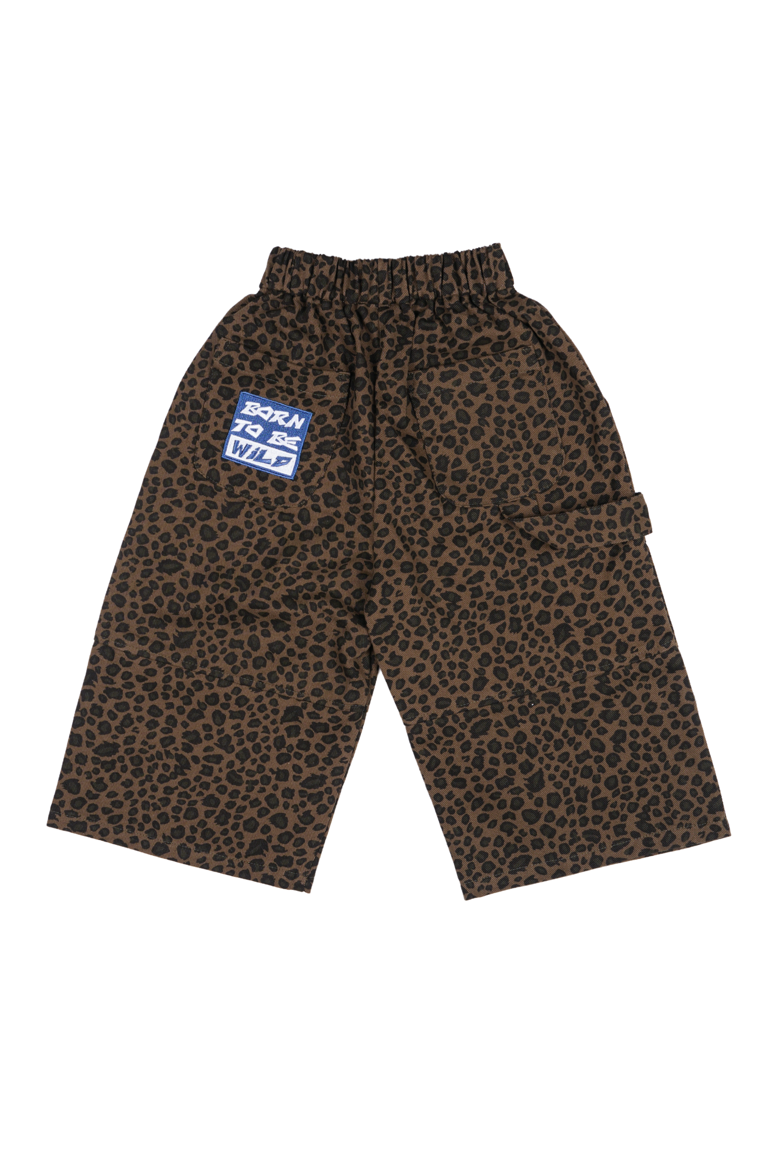 Franco's Dad ~ PRE-ORDER Leopard Cargos by FRANCO'S DAD: Oversized leopard print pants with a "Born to Be Wild" blue patch on the left side. Featuring a stretch waistband and wide legs for comfort and style in mid-weight denim.