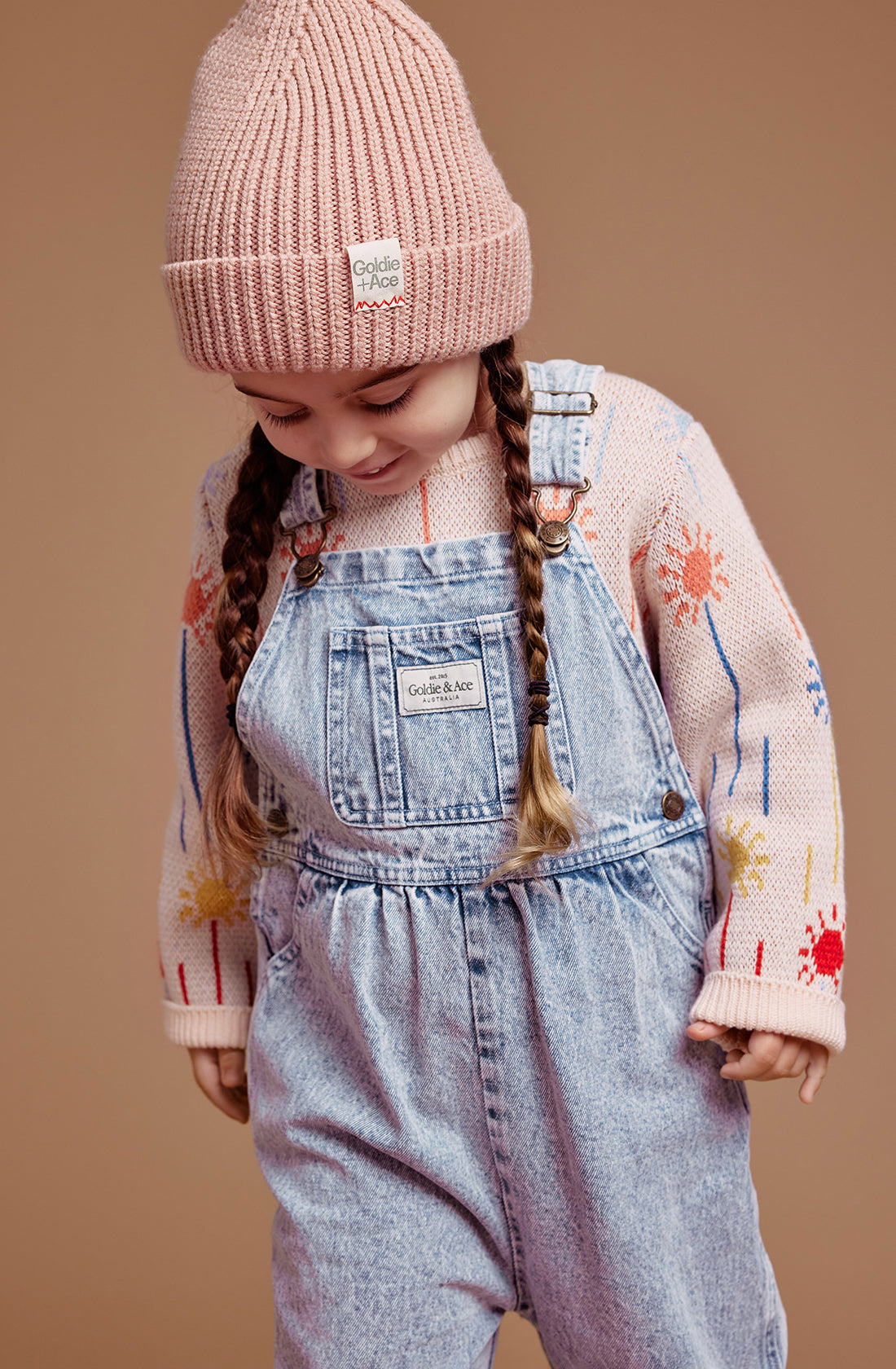 A young girl wearing the GOLDIE + ACE  Wool Beanie in tulip.