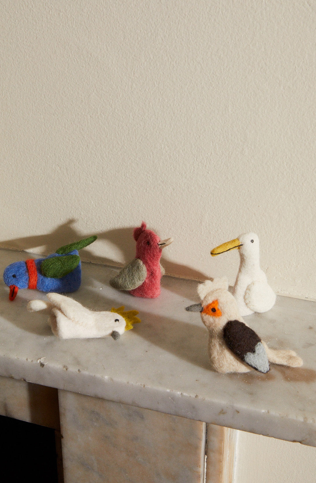 Australian finger puppets standing up and lying on their side.