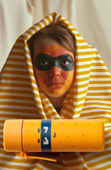 Boy with orange facepaint hiding under orange striped cloth with frankster  Robin