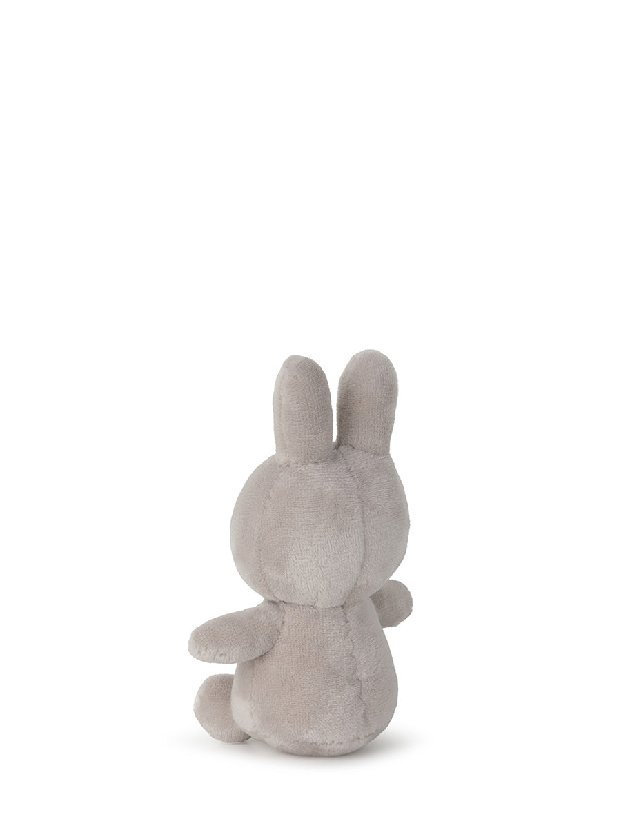 A Lucky Miffy in Giftbox Grey 10cm plush toy by BON TON TOYS X MIFFY, handcrafted from recycled polyester, is shown from the back. The toy features long ears, a round body, and small limbs against a plain white background.