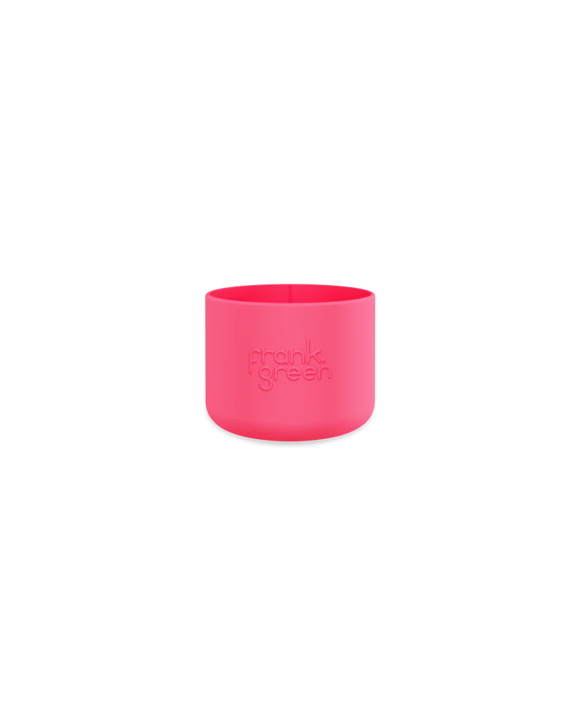 The FRANK GREEN Bottle Bumper Guard Small Neon Pink is a bright pink rubber cup holder designed to fit snugly around reusable cups, like the Ceramic Reusable Bottle, for optimal insulation and grip.