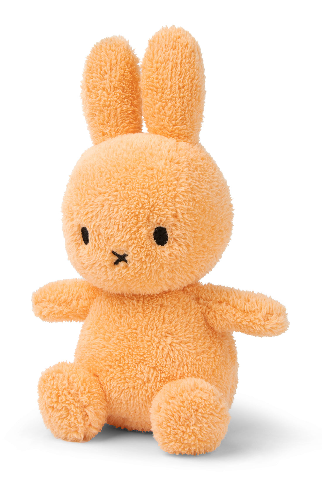 Introducing the Miffy Sitting Terry Soft Orange 23 cm from BON TON TOYS X MIFFY. This plush toy bunny, featuring fluffy orange fur, large ears, black dot eyes, and a small black 'X' shaped mouth, is a delightful addition to the Miffy Terry Collection. Handcrafted with care and depicted in a sitting position against a plain white background, it makes the ultimate baby gift for any occasion.