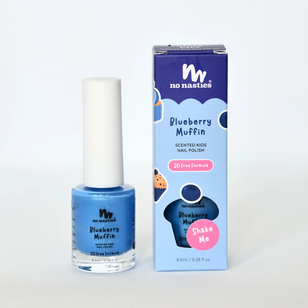 A bottle of NO NASTIES Scented Scratch Off Kids Nail Polish in Blueberry Muffin/Blue stands beside its box, which features playful blueberry graphics and highlights its kid-friendly scented "20 free" formula.