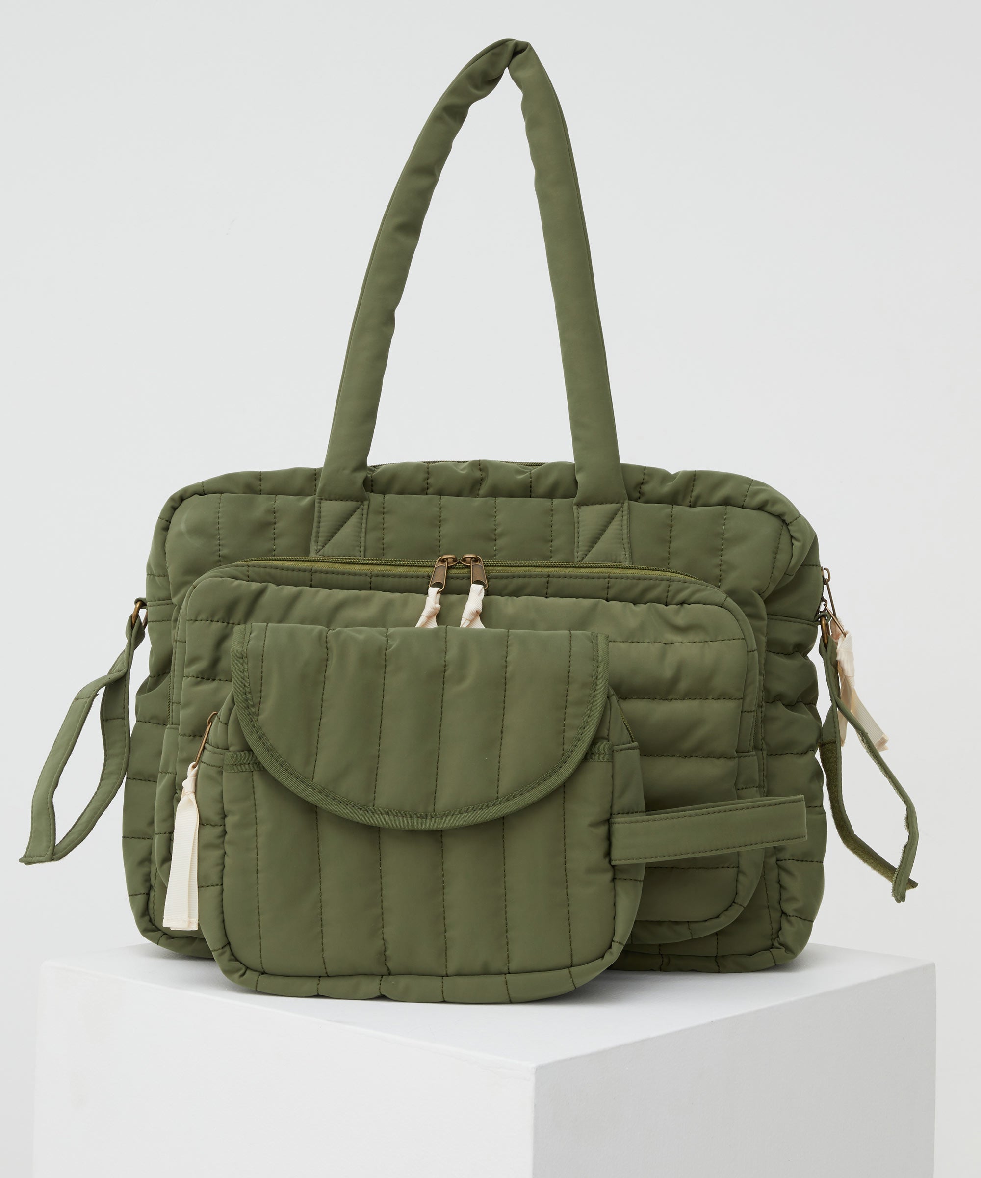 PHILÉ baby bag in khaki in large and small.