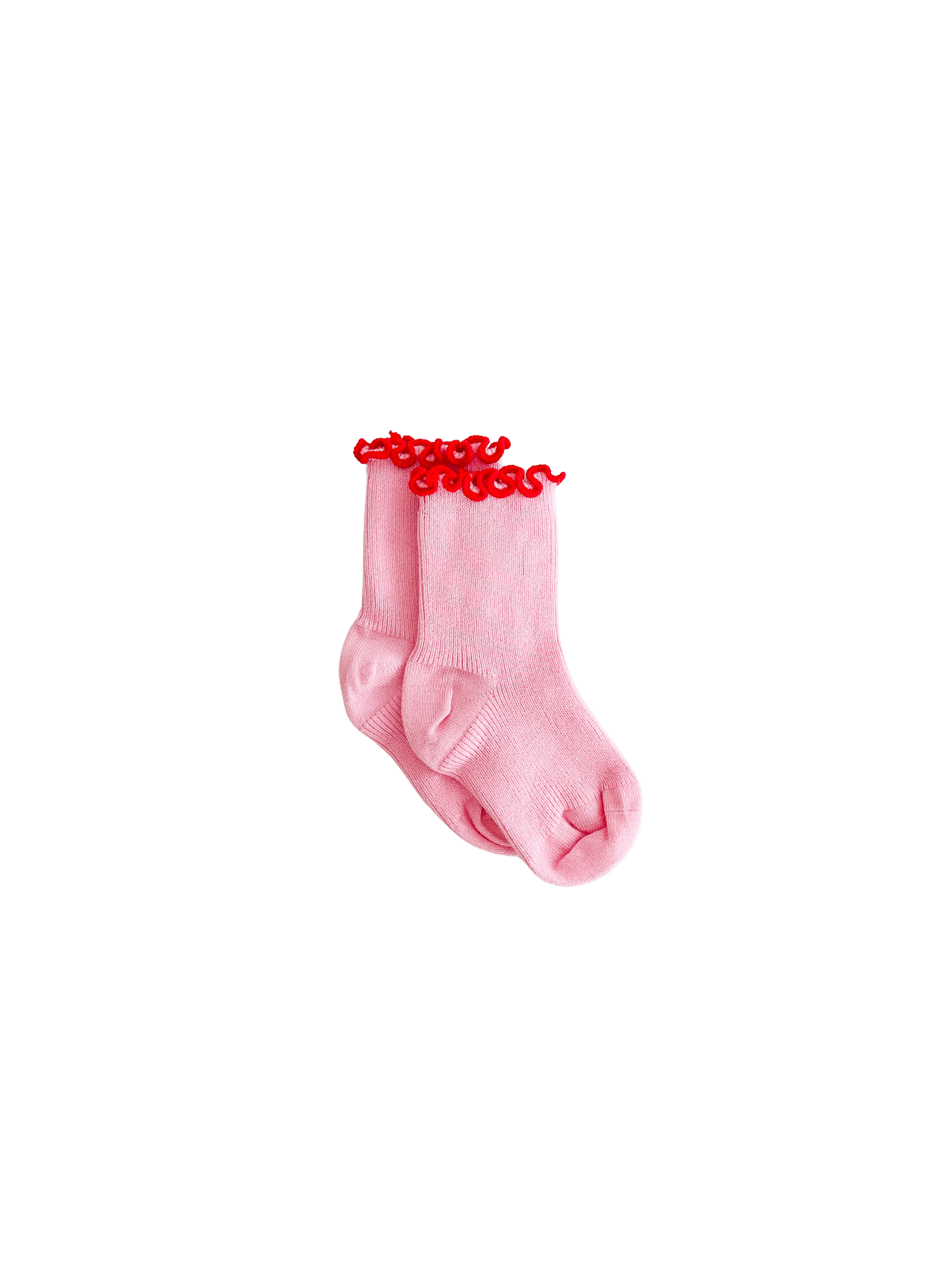 A pair of Ziggy Lou Elodie socks against a black background. These pink socks from ZIGGY LOU have a decorative bright red ruffle edge at the top, adding a playful touch to their simple design.