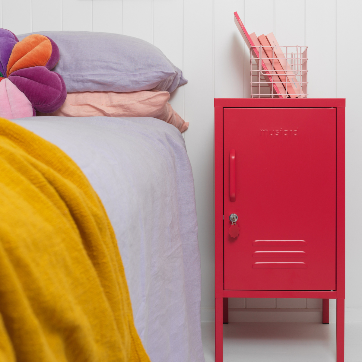 The shorty (to the right) locker in poppy next to bed.