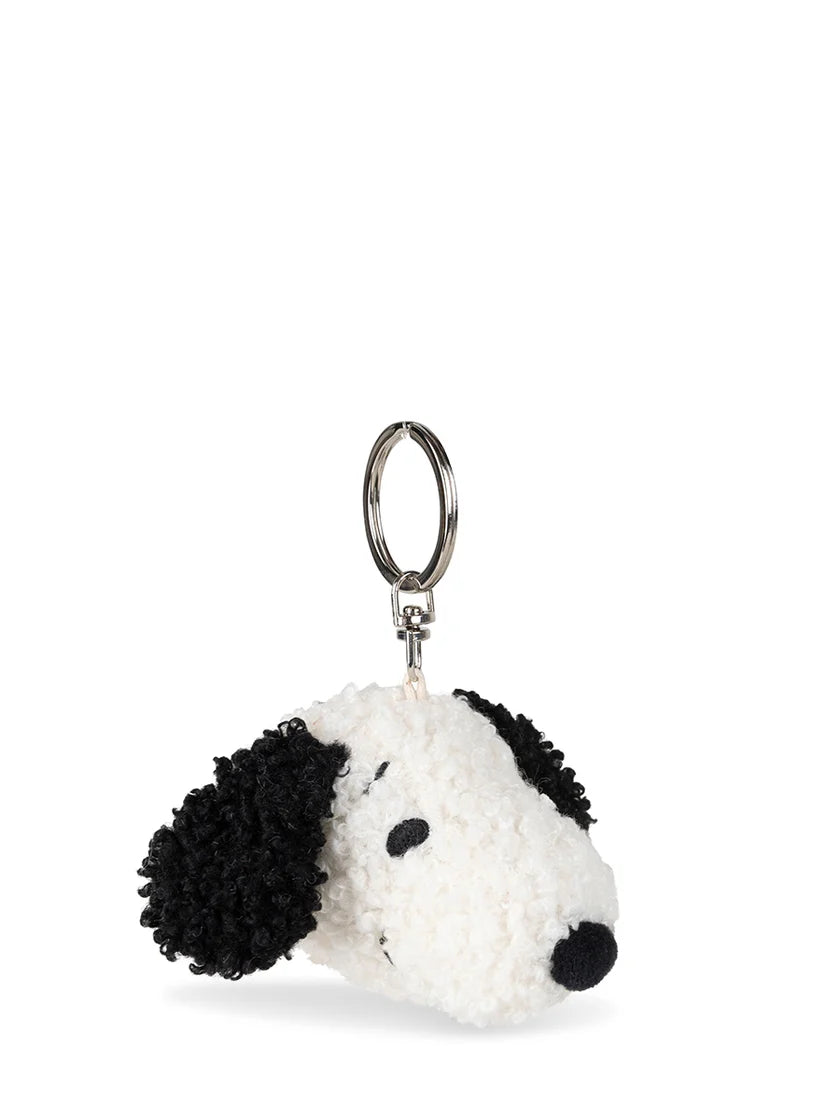 The Bon Ton Toys - Snoopy ECO Tiny Teddy Cream Keychain 4.5cm by BON TON TOYS X MIFFY features a plush Snoopy head with curly black ears, black nose, stitched eyes on a white face, made from recycled polyester and attached to a metal keyring.