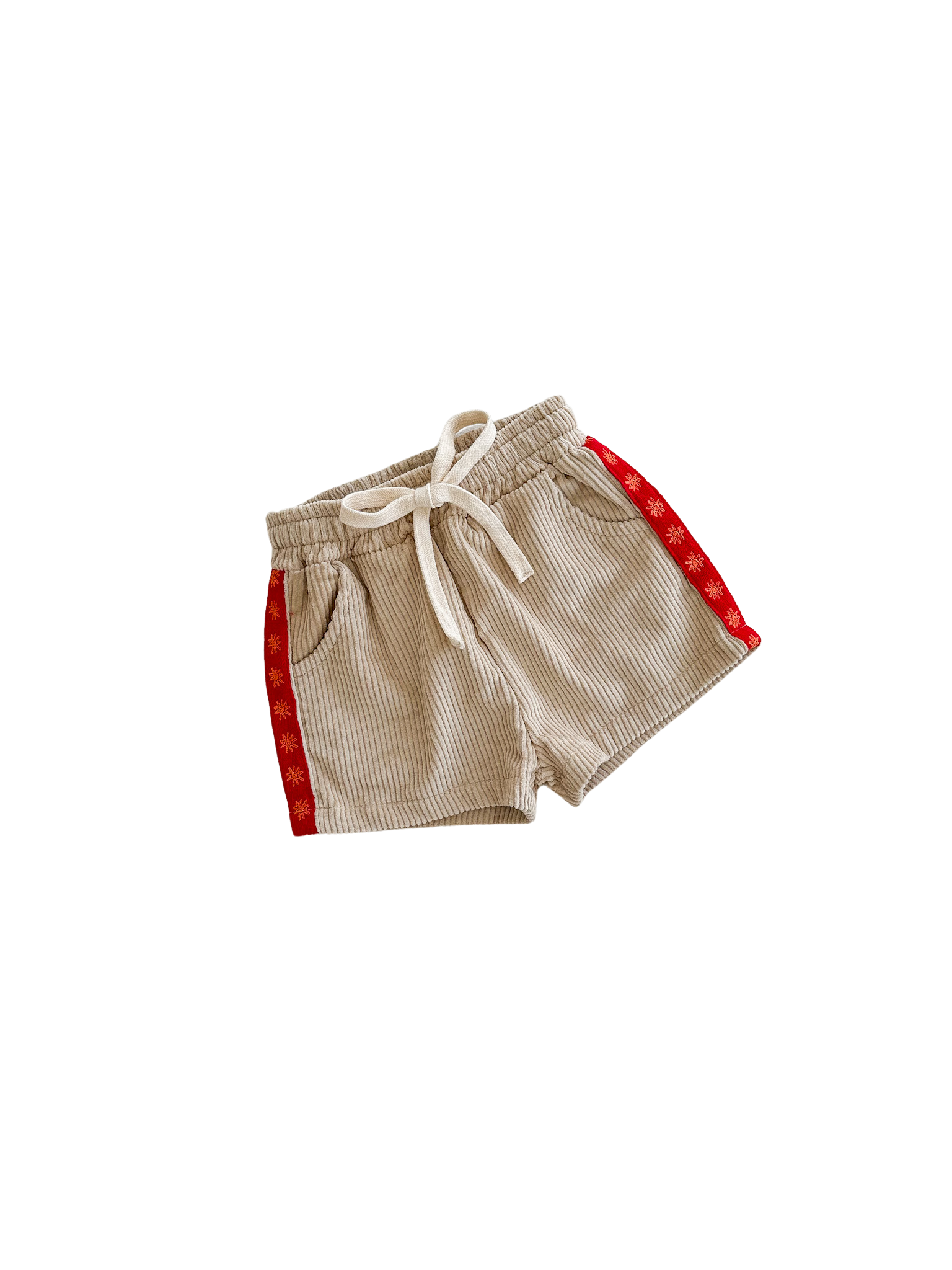 Ziggy Lou's Cord Shorts Chilli by ZIGGY LOU feature a beige cotton corduroy design, an elastic waistband with a white drawstring, red side panels, and a delicate small yellow flower pattern—adding charm to any outfit.