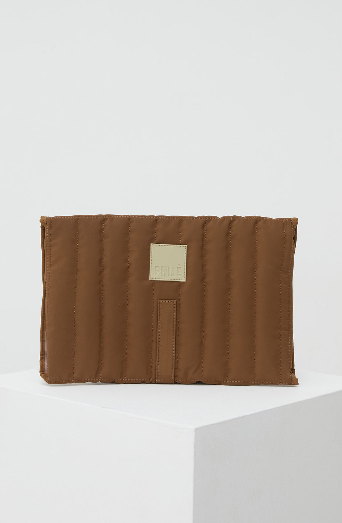 PHILÉ travel changing mat in brown from the back.