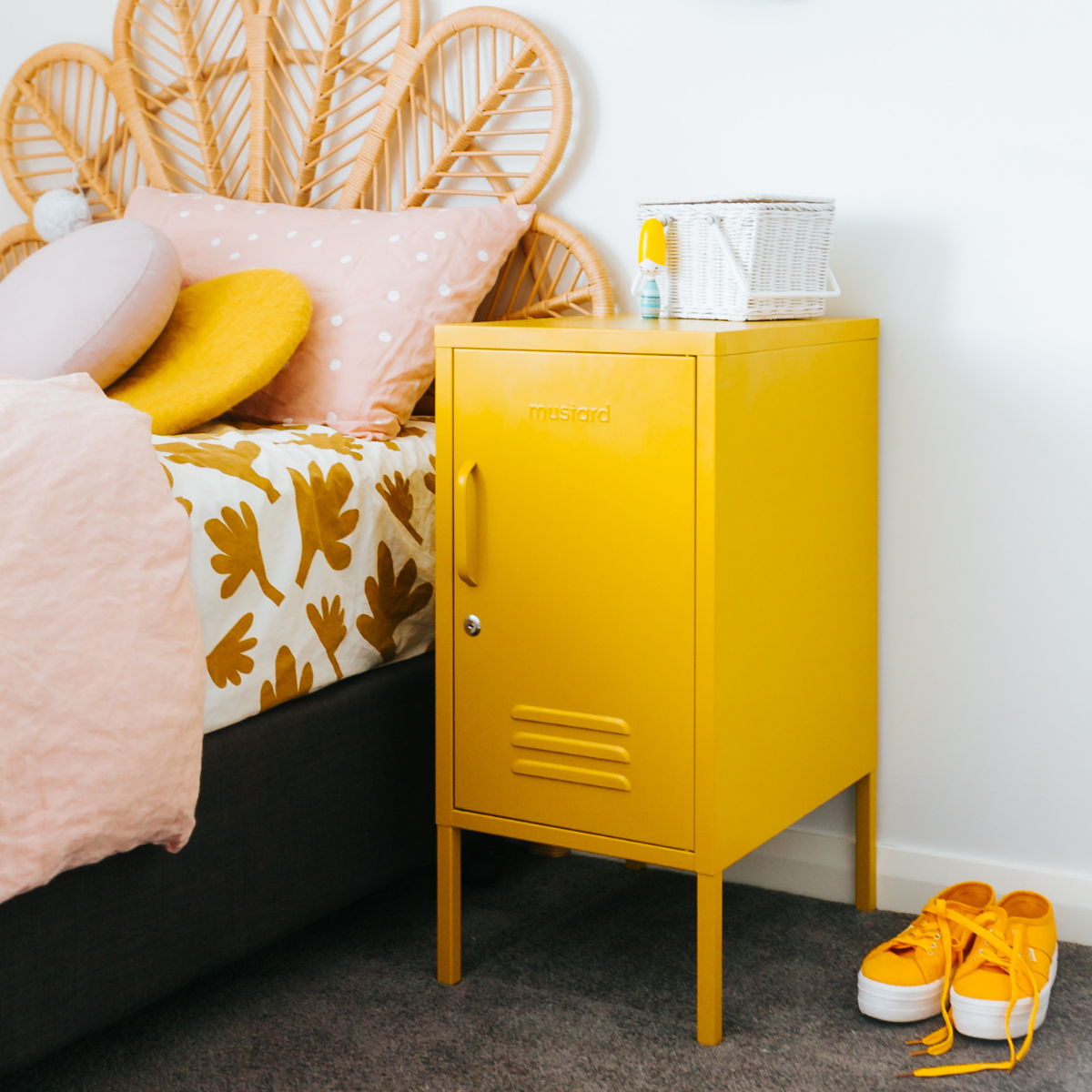 The shorty (to the right) locker in mustard next to bed.