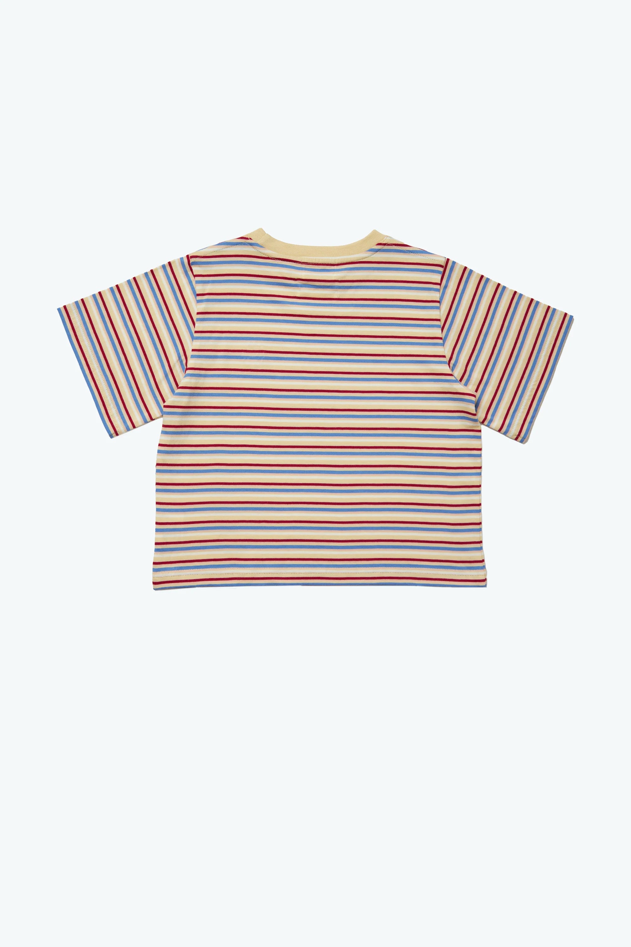 The Stripe Sloppy Tee by KOKOMO offers an oversized fit and showcases vibrant horizontal stripes in blue, red, yellow, and green against a light background. Crafted from organic cotton and set against a plain white backdrop, it complies with the Fairtrade Textile Standard for conscientious fashion enthusiasts.