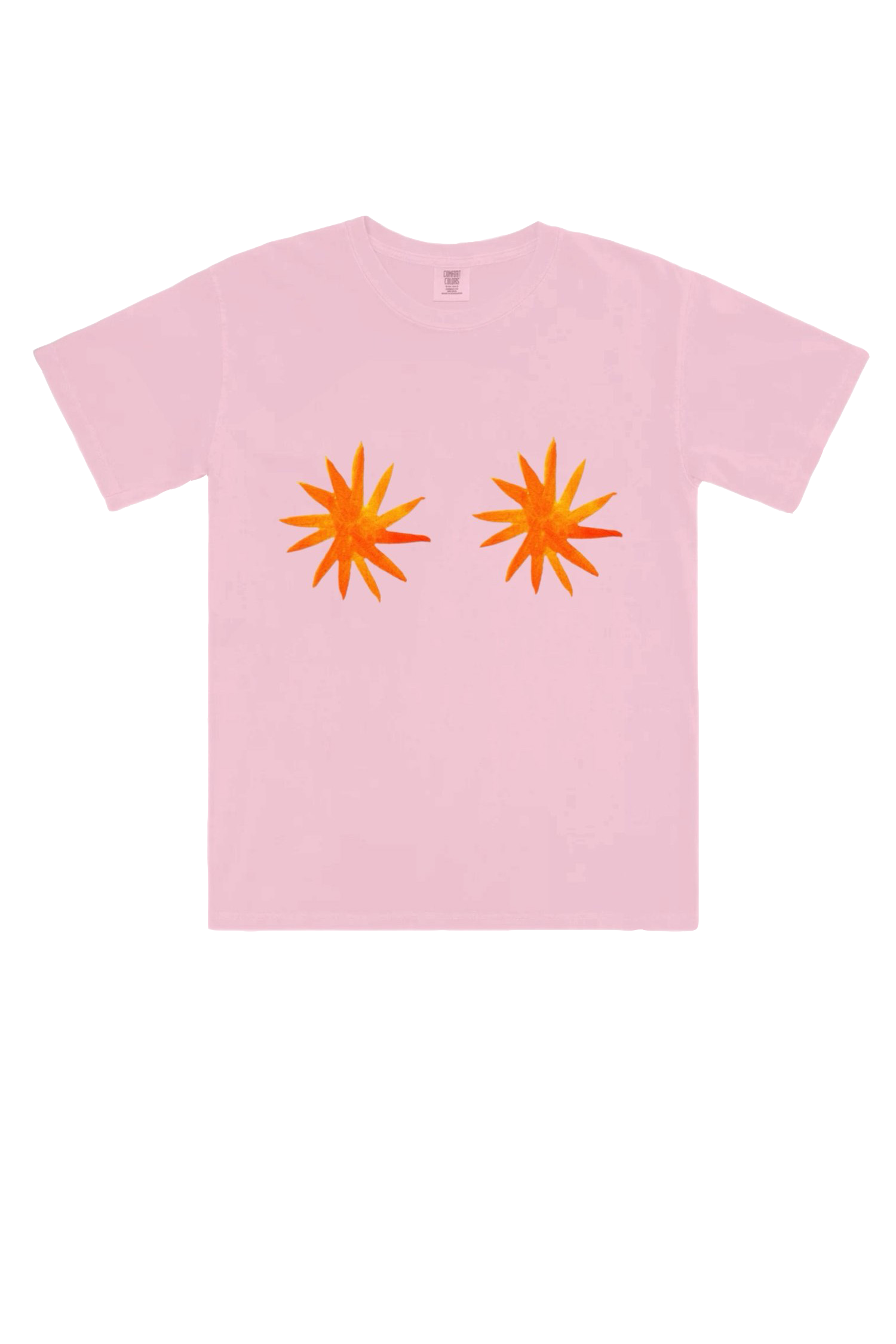 The Star Boobies T-Shirt by MAKU FENAROLI showcases hand-painted designs of two vibrant orange starbursts on the chest. These symmetrical bursts add a unique touch, standing out beautifully against the light pink background of this unisex tee, crafted from 100% cotton.