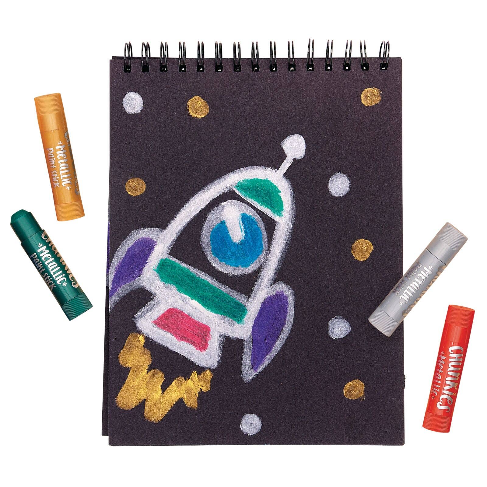 A drawing of a rocket with green, yellow, silver and red chunkies paint sticks scattered around it.