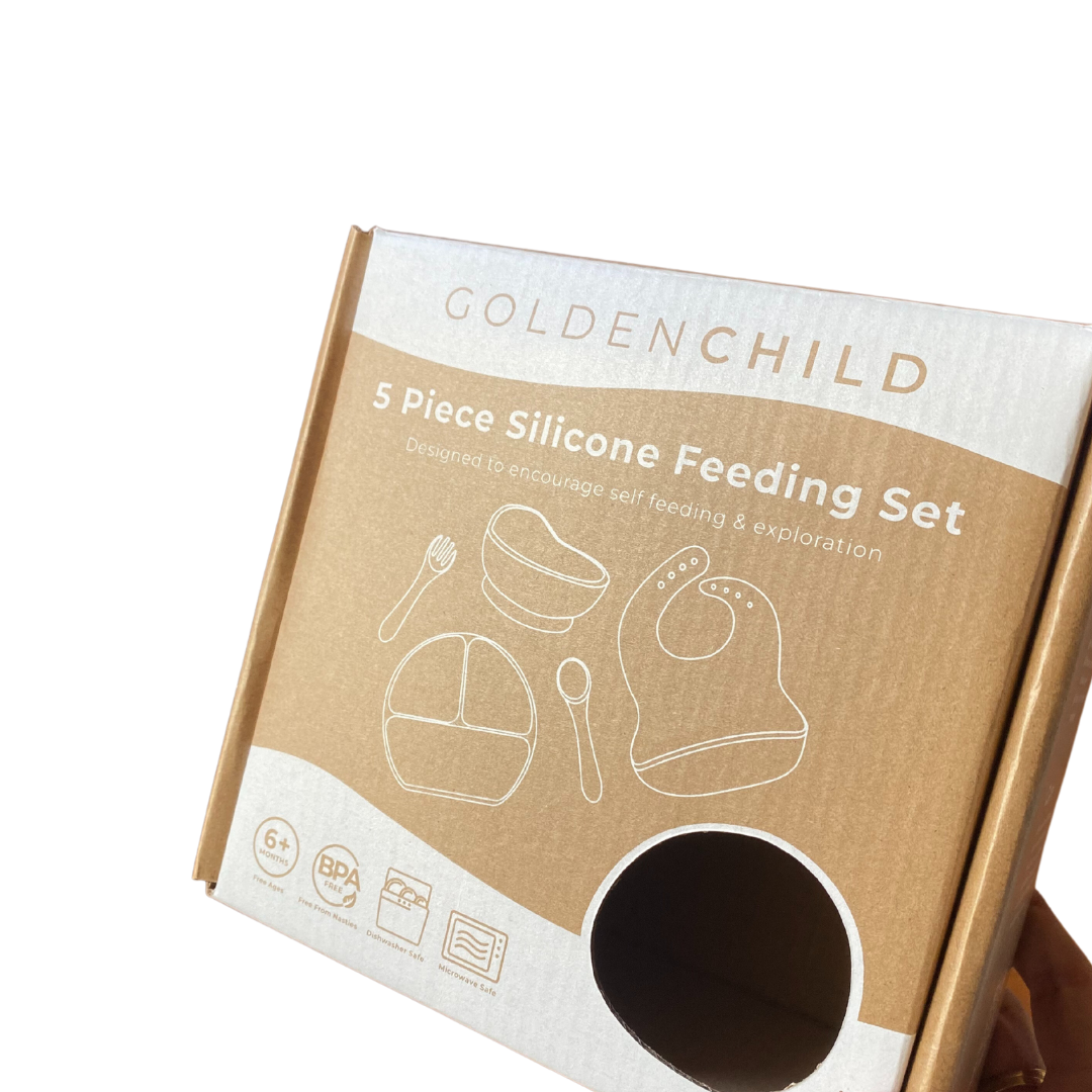 Three piece children’s BPA free silicone feeding set in lilac in its cardboard packaging.