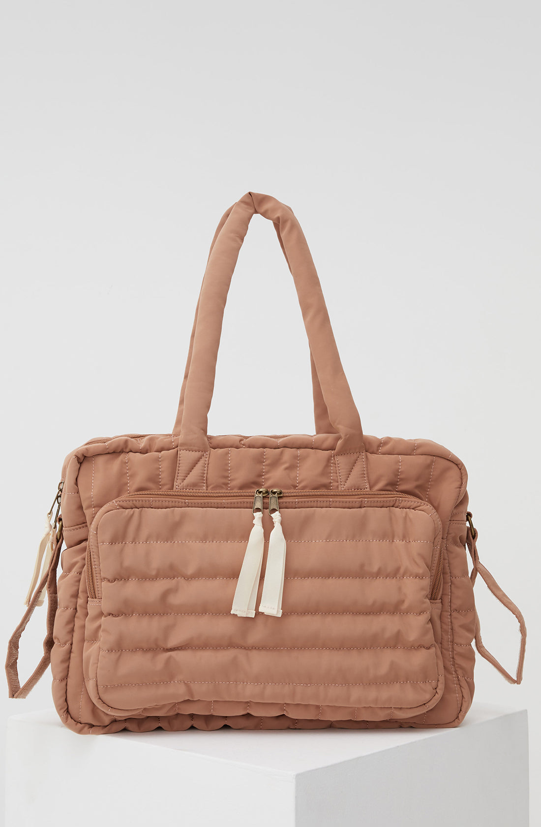 PHILÉ baby bag in terracotta.