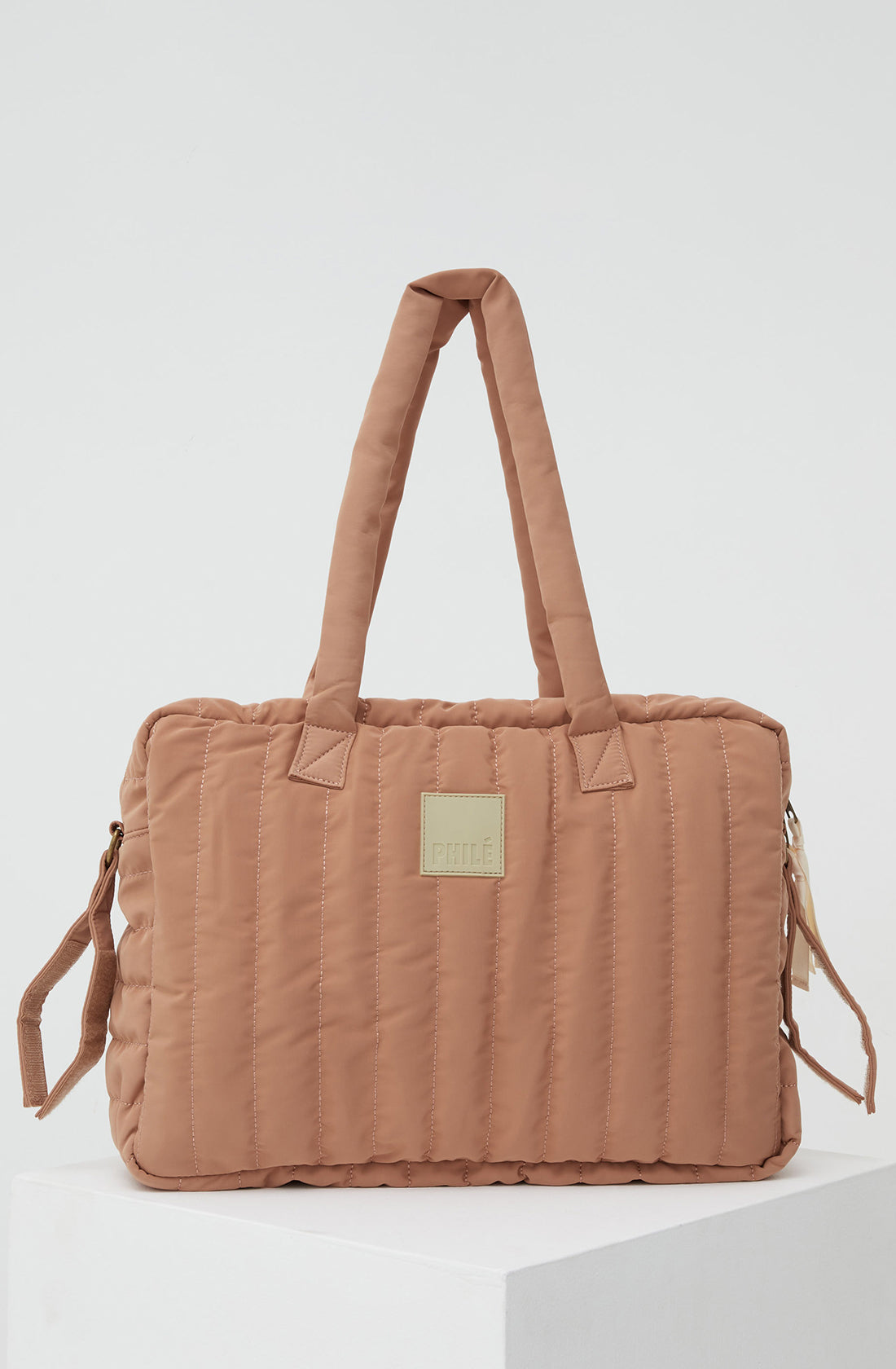 PHILÉ baby bag in terracotta from the back.