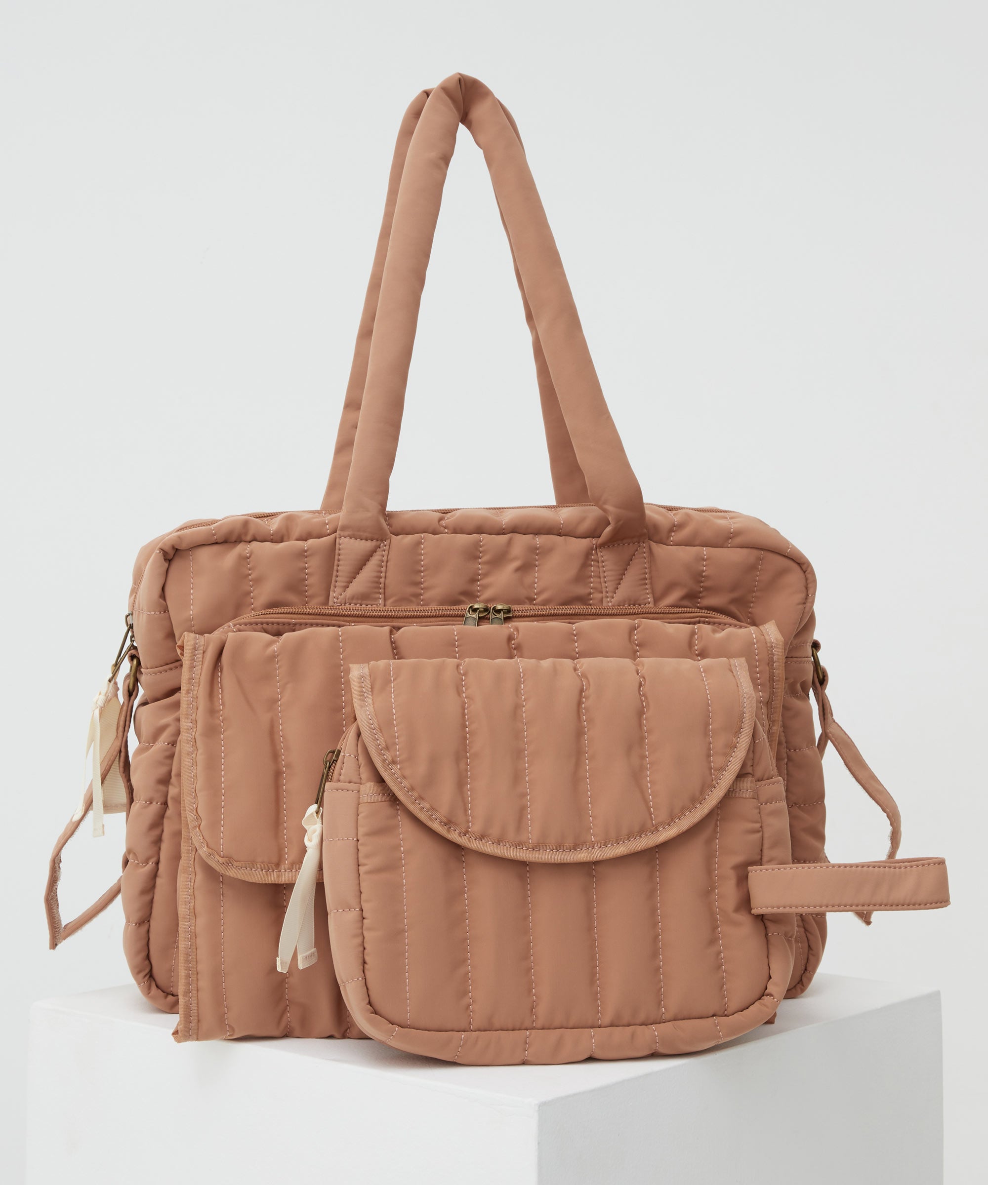 PHILÉ baby bag in terracotta in large, medium and small.