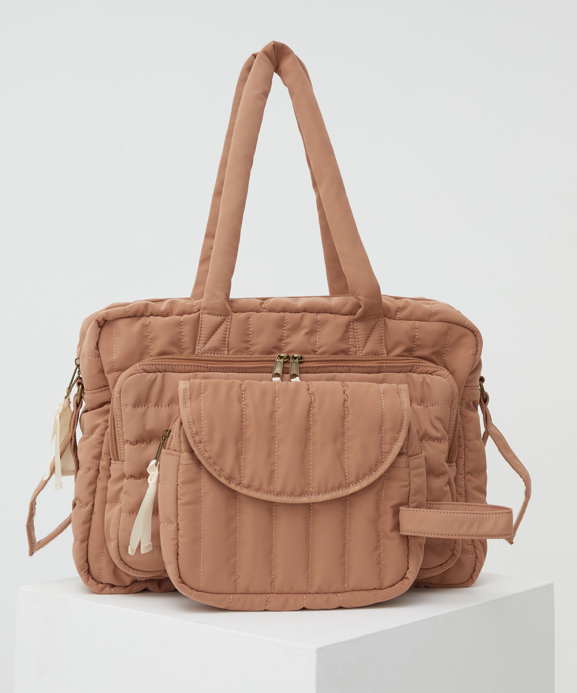 PHILÉ baby bag in terracotta in large and small.