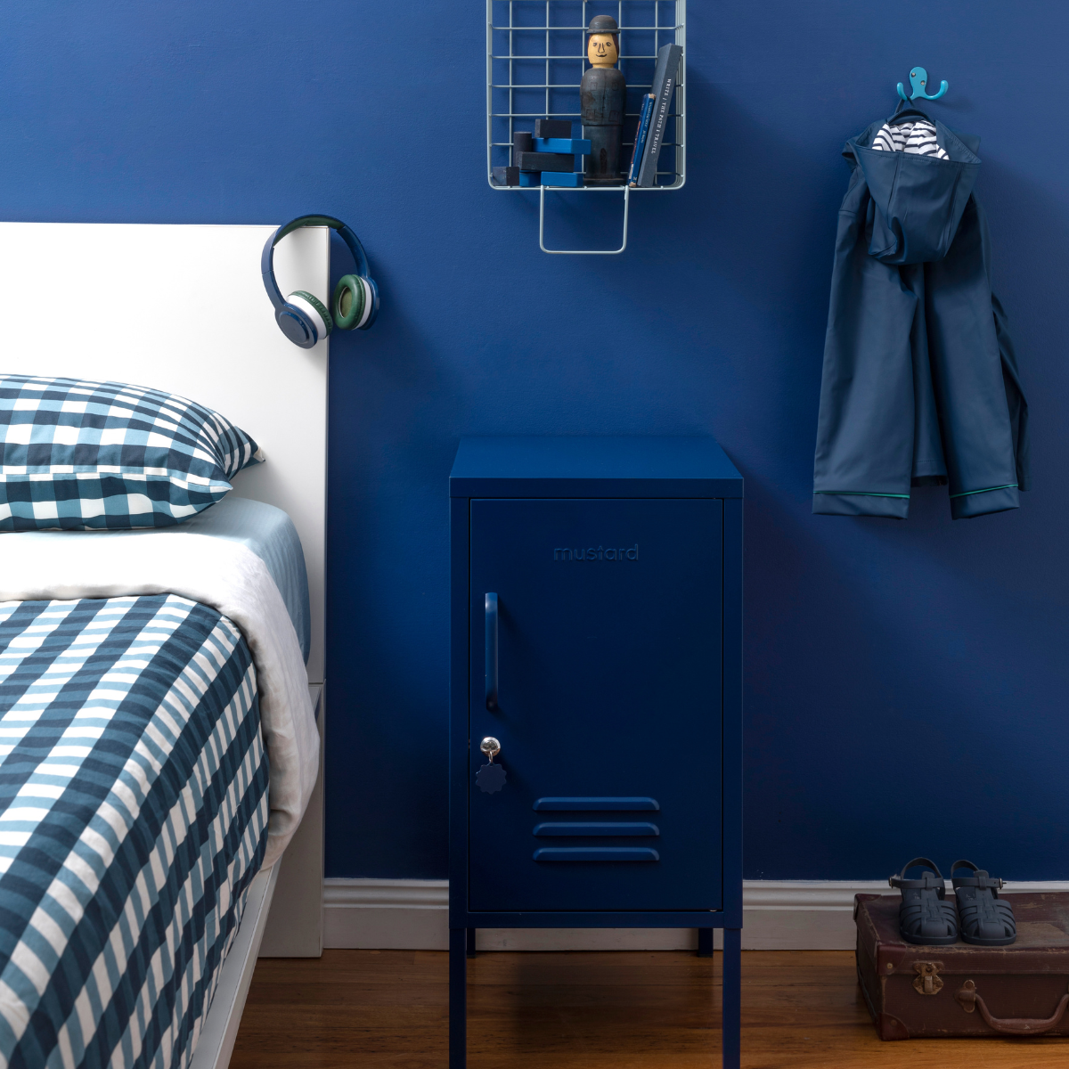 The shorty (to the right) locker in navy next to bed.