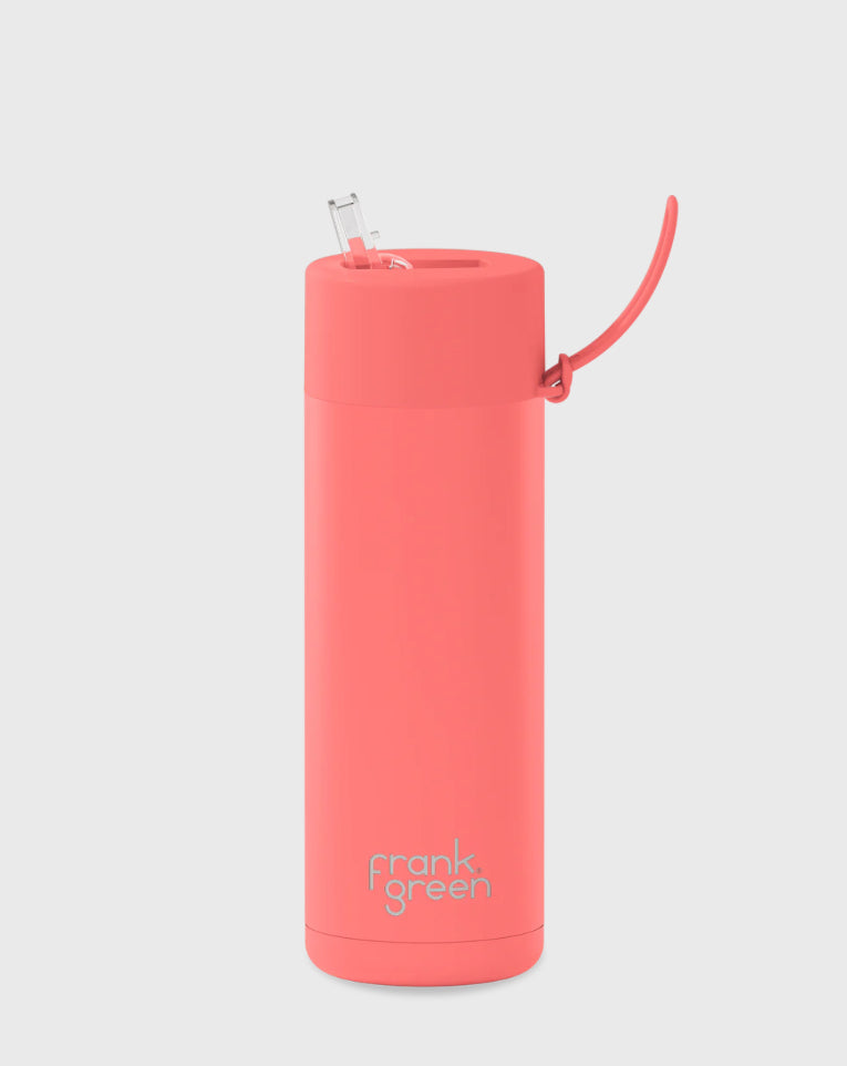 A tall, cylindrical Ceramic Reusable Bottle in the Sweet Peach color with a spout and a curved handle attachment on the lid. The text "FRANK GREEN" is visible near the base of this 595ml, 20oz BPA-free water bottle. The background is plain white.