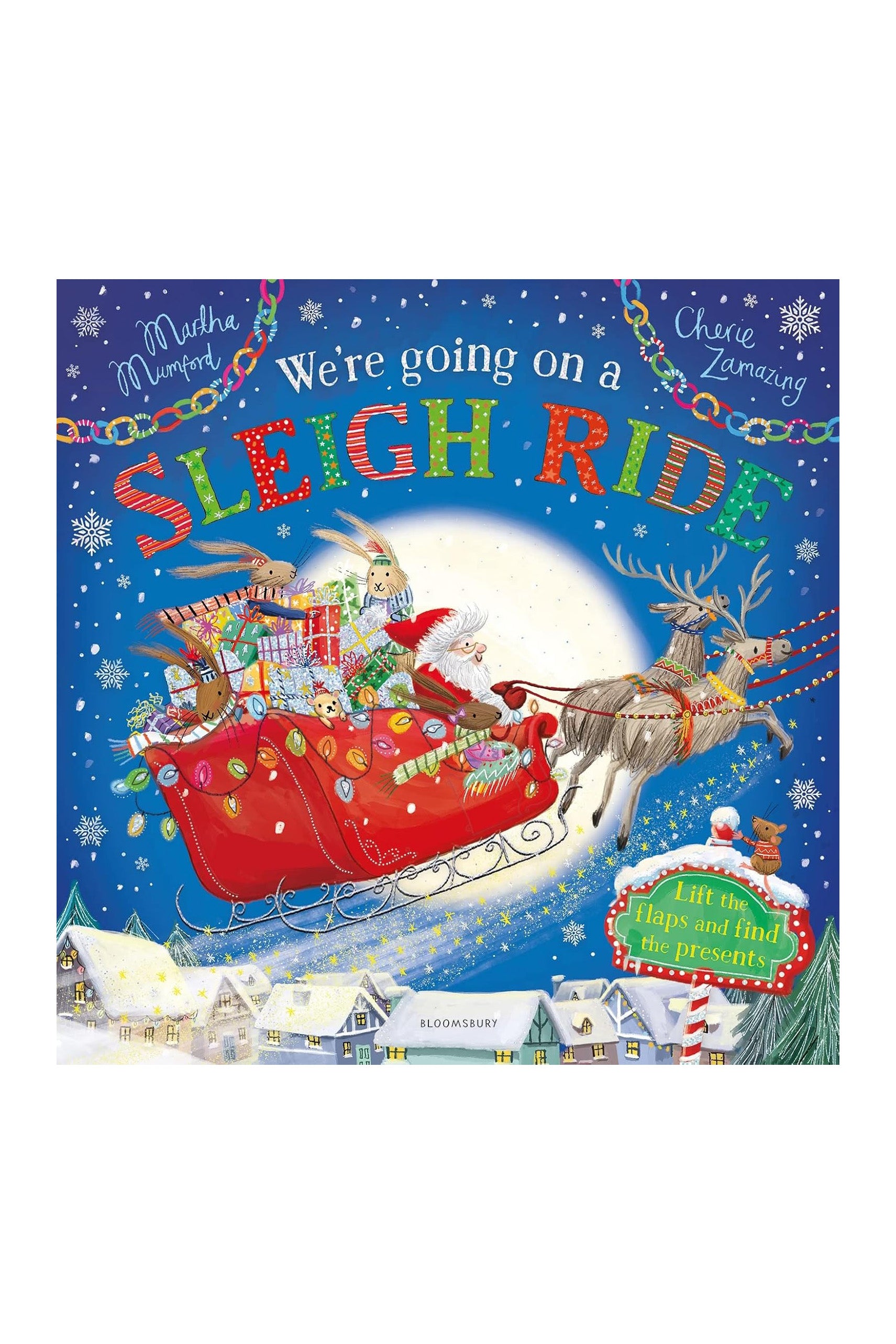 Children's book cover titled "We're Going on a Sleigh Ride: A Lift-the-Flap Adventure" by Martha Mumford and Cherie Zamazing, under the BAY KIDS brand. It features Santa's sleigh packed with gifts, led by reindeer over a snow-covered village in a festive journey. The cover is adorned with colorful lights and includes a sticker: "Lift the flaps.