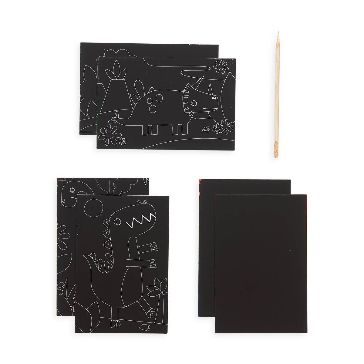 3 piles of two black pieces of paper, with two of them having dinosaur drawings on them and a pencil next to one pile.