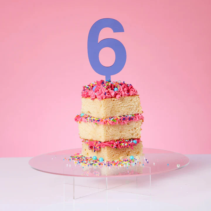 A number six large cake topper in blue.