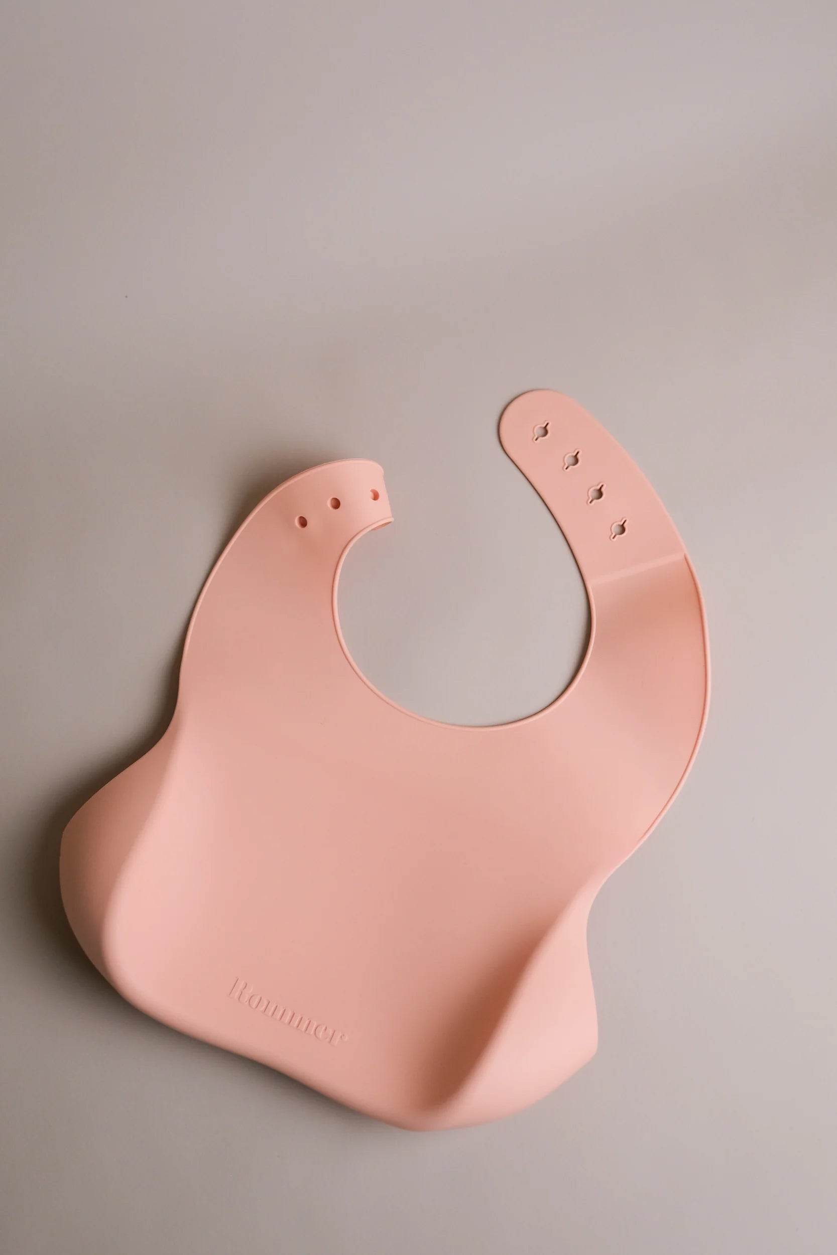 ROMMER Silicone Bib in Melon from back.