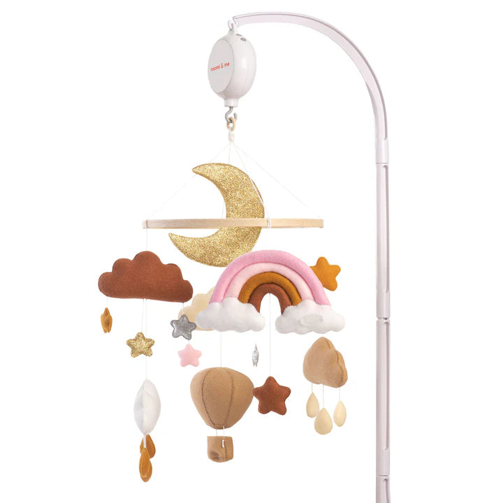 The ROOMI & ME Roomi & Me - Baby Mobile Sparkly Galaxy features handmade plush shapes—a gold glitter moon, rainbow, clouds, stars, hot air balloon, and raindrops—hanging from a white arm for soothing visual stimulation.