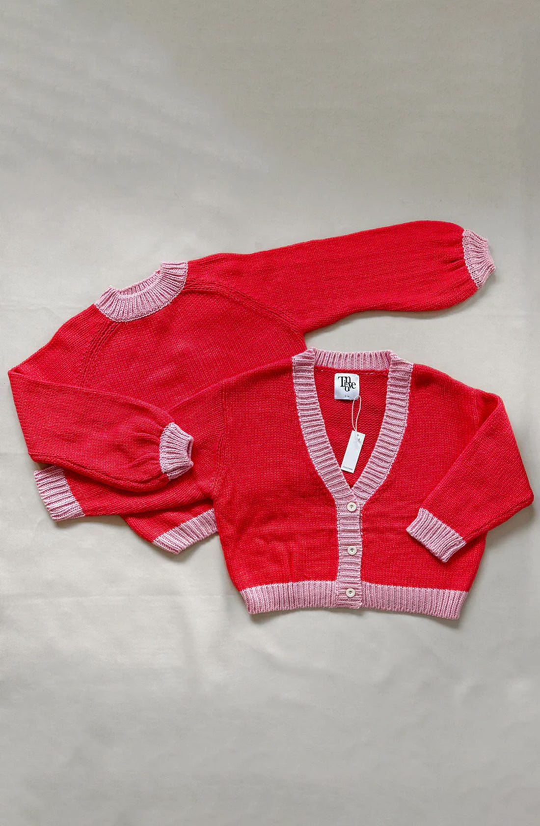 The adult mia contrast knit jumper in red/pink.