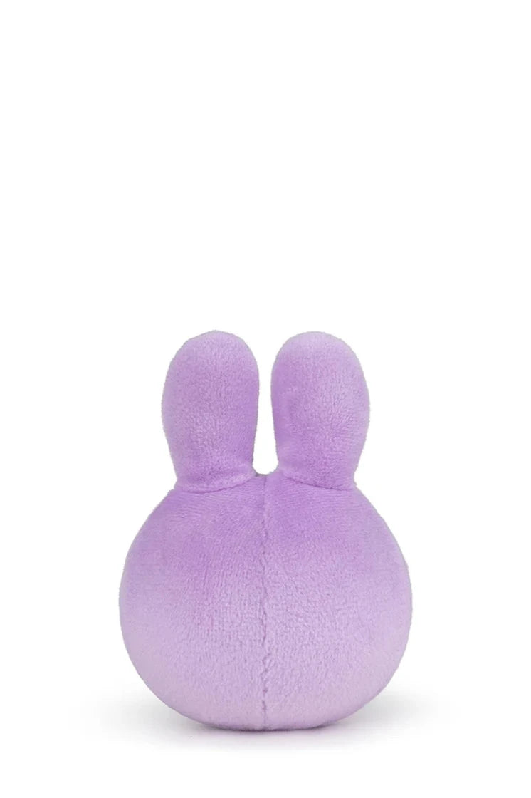 The Miffy Squish Ball Lilac by BON TON TOYS X MIFFY, a small round purple plush with two upright ears against a white background, offers stress relief with its soft texture.