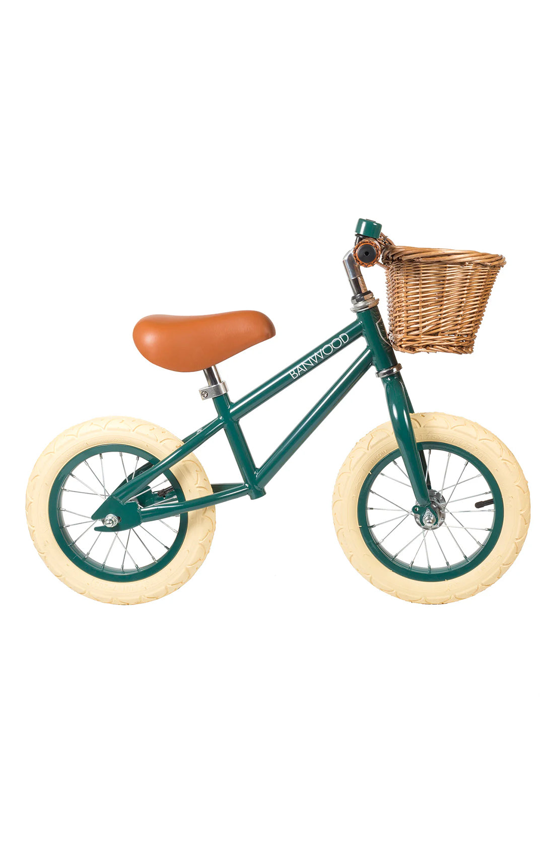 A side on shot of a dark green banwood vintage balance bike with a straw basket.