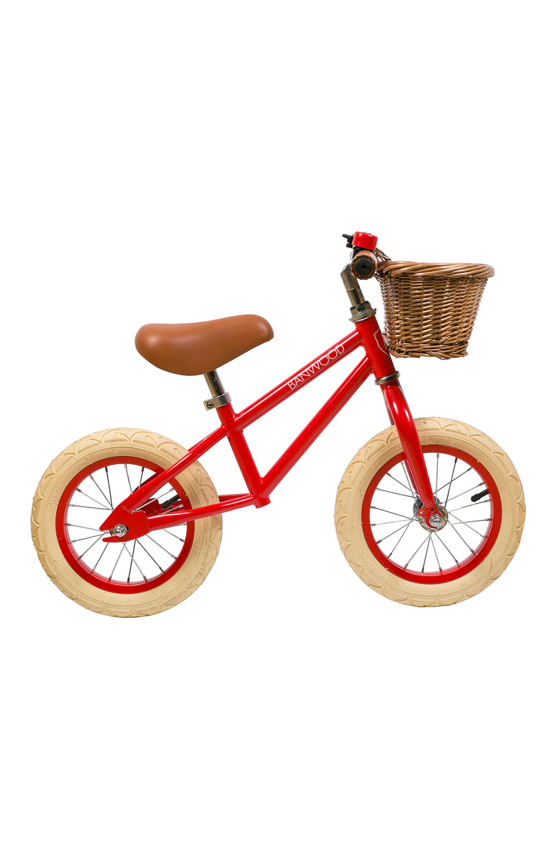 A side on shot of a red banwood vintage balance bike with a straw basket.