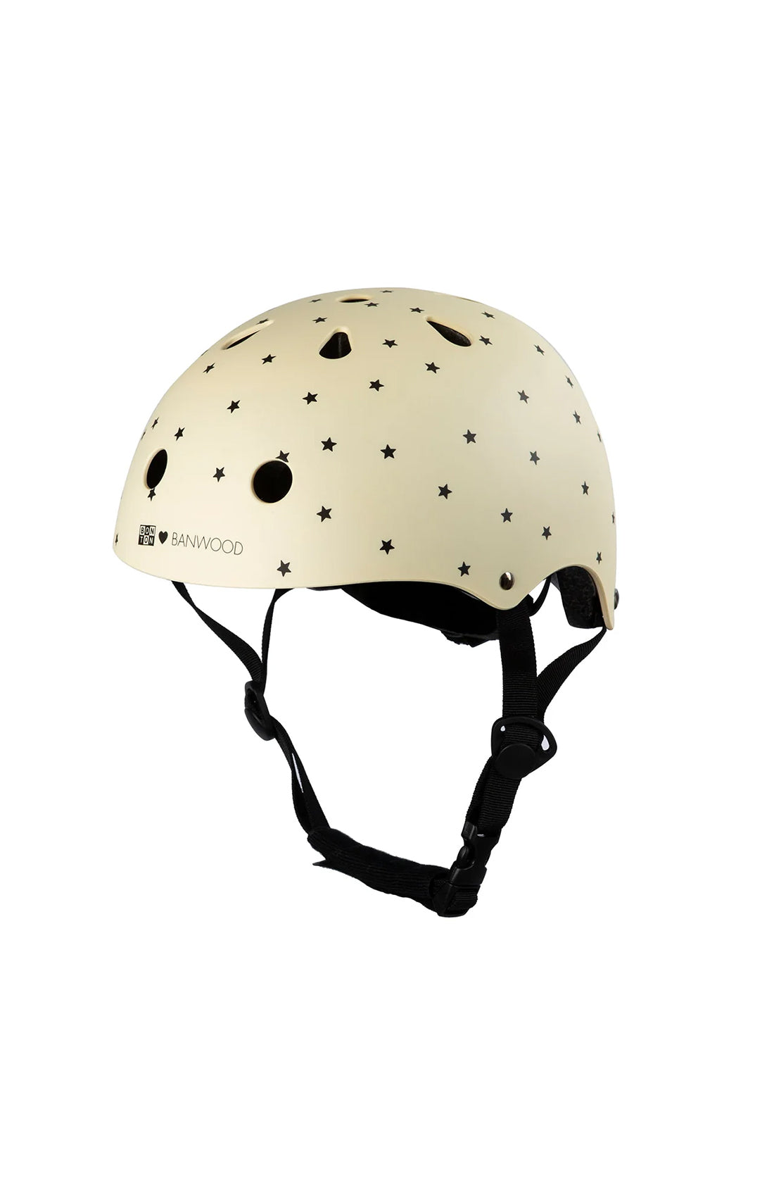 A bonton x banwood helmet in cream with black stars on a white background.