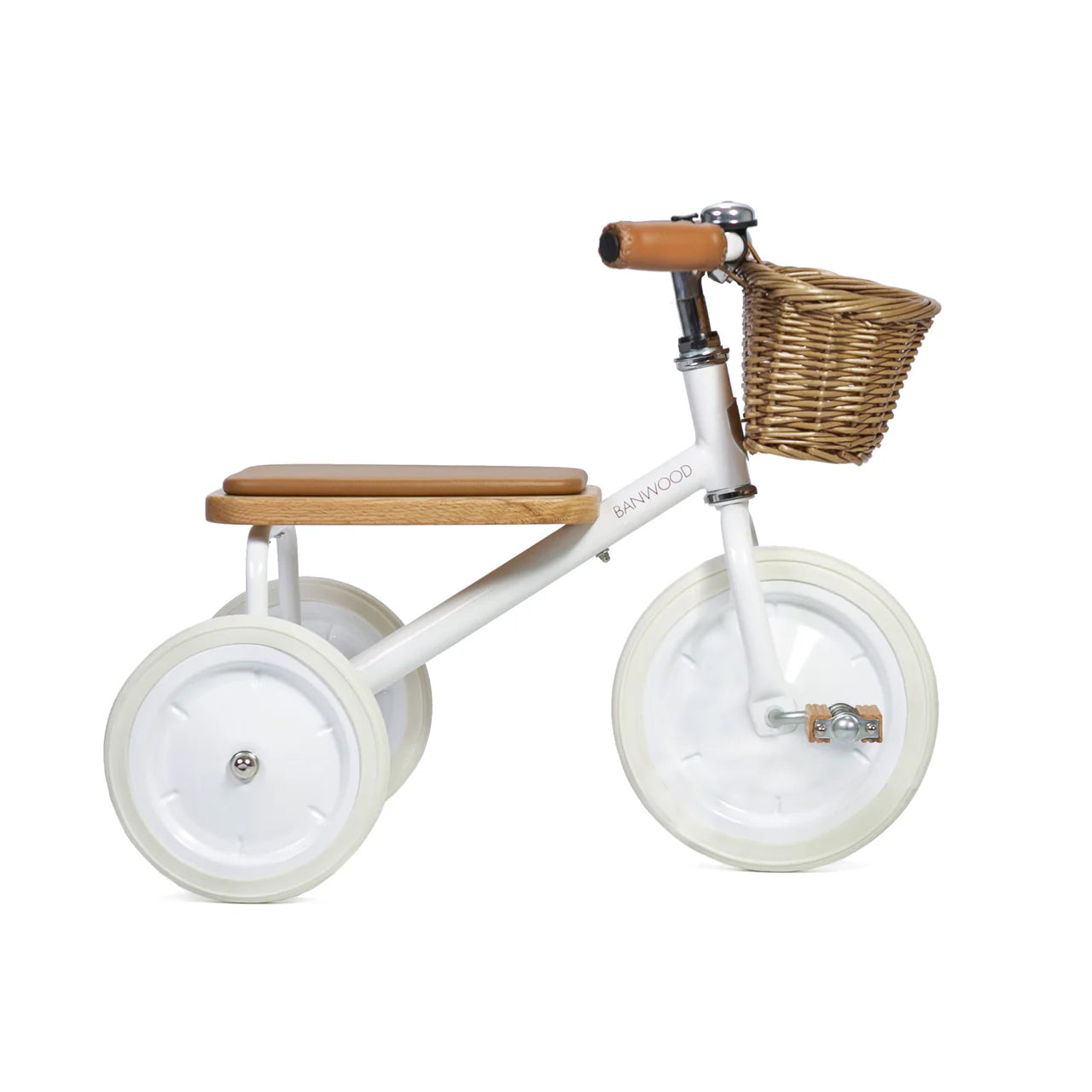 A side on shot of a white banwood trike with a straw basket.